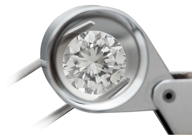 Brilliant round lab diamond inspected by a magnifying lens